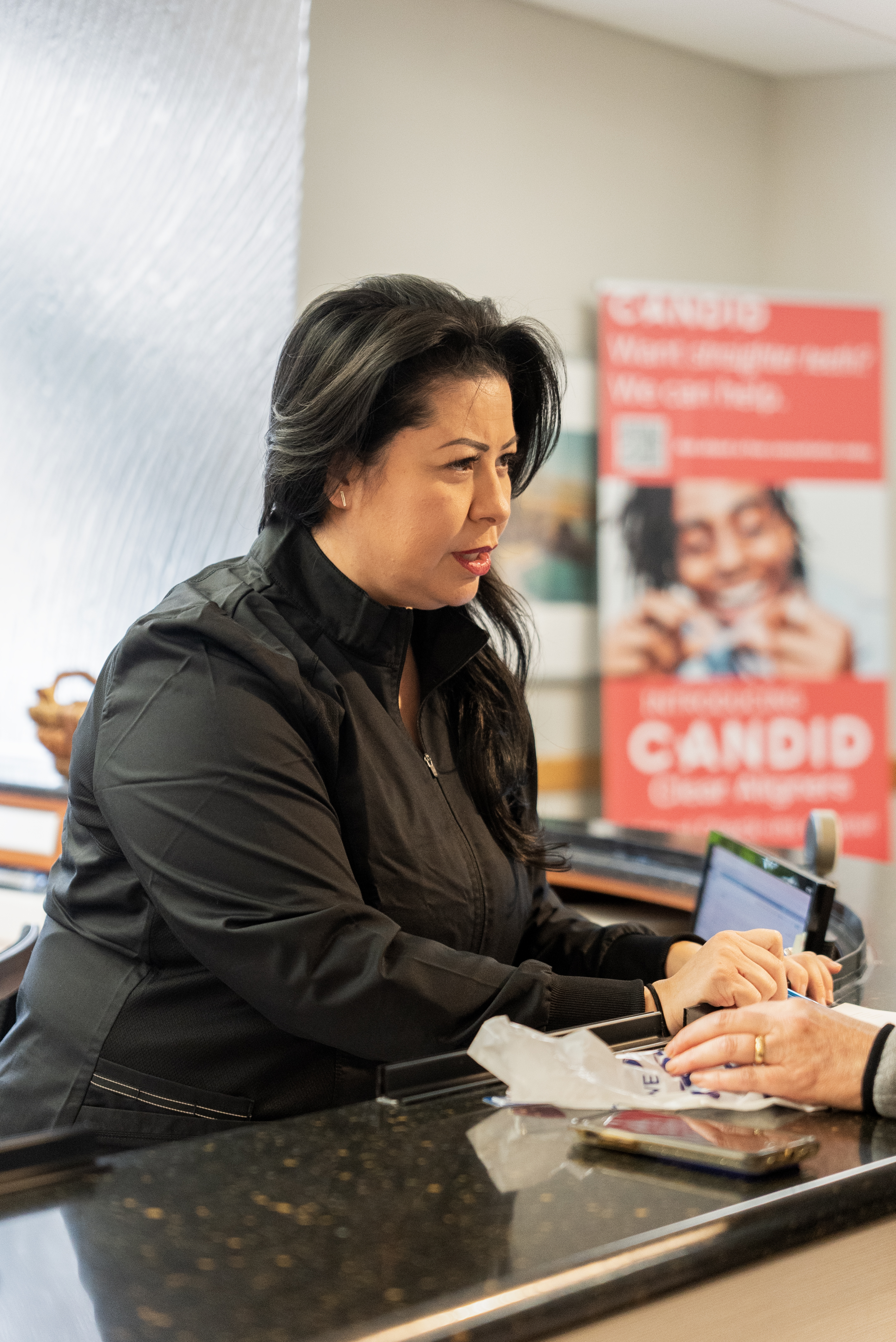 Receptionist explaining guidelines