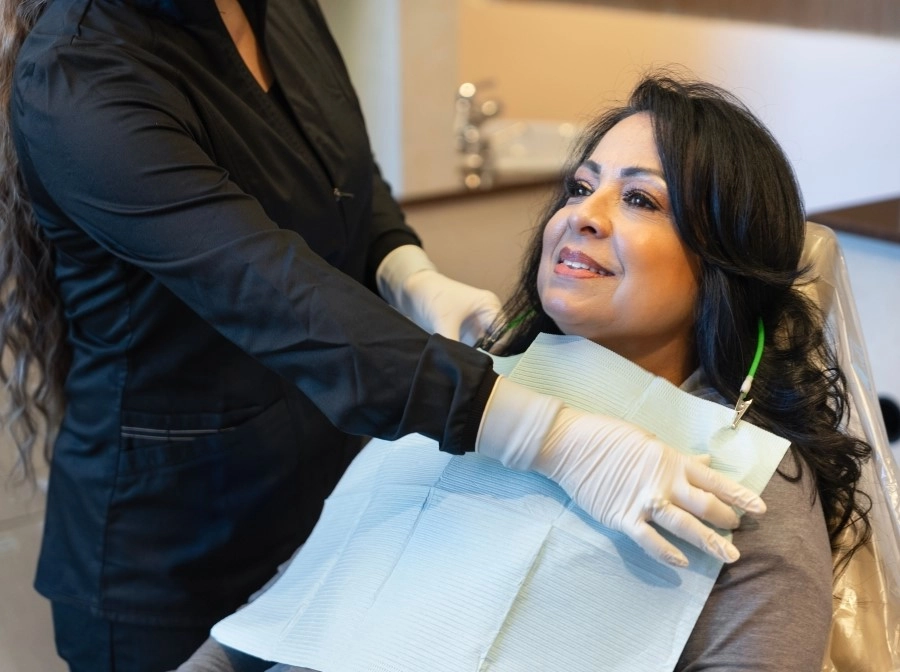 woman sitting in a dental chair, prepared for a dental bonding procedure in Los Gatos