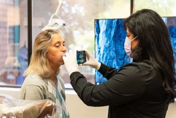 Patient receiving an all-ceramic dental crown restoration