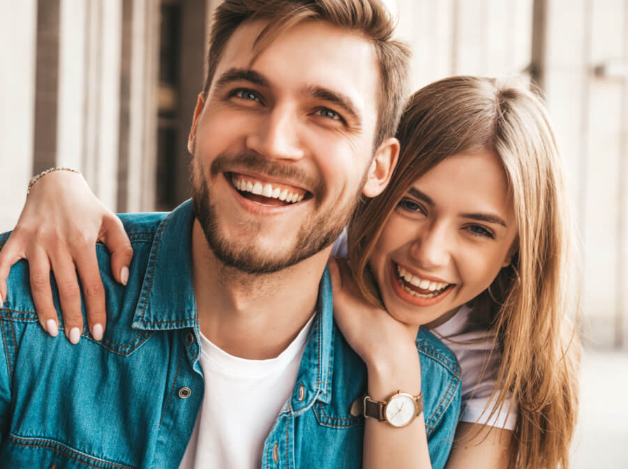 Man and woman with attractive smiles after cosmetic dentistry