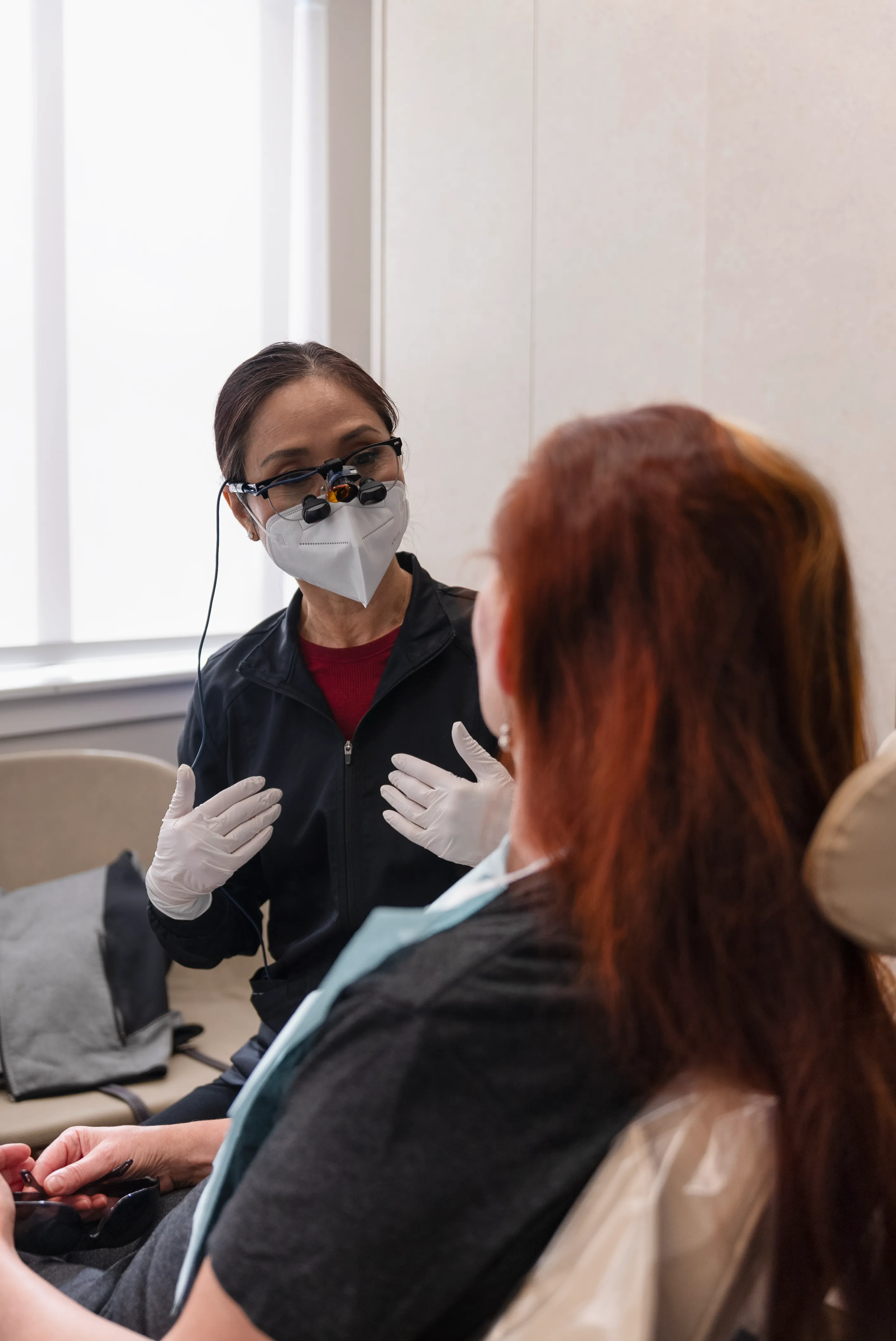 Woman smiling after teeth whitening treatment