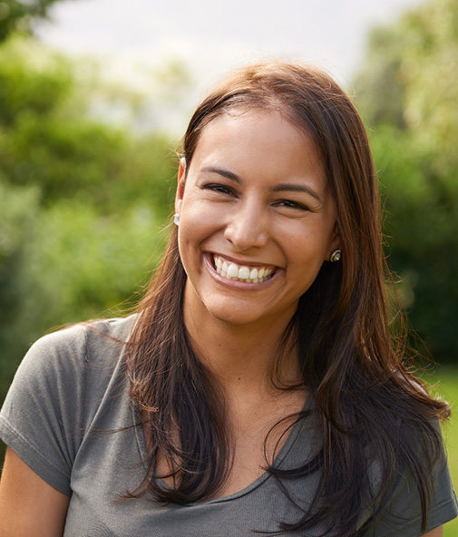 Close-up of woman outside and smiling