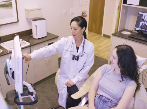 Dental patient smiling during dental exam