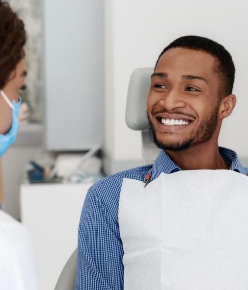 Man smiling after gum disease treatment