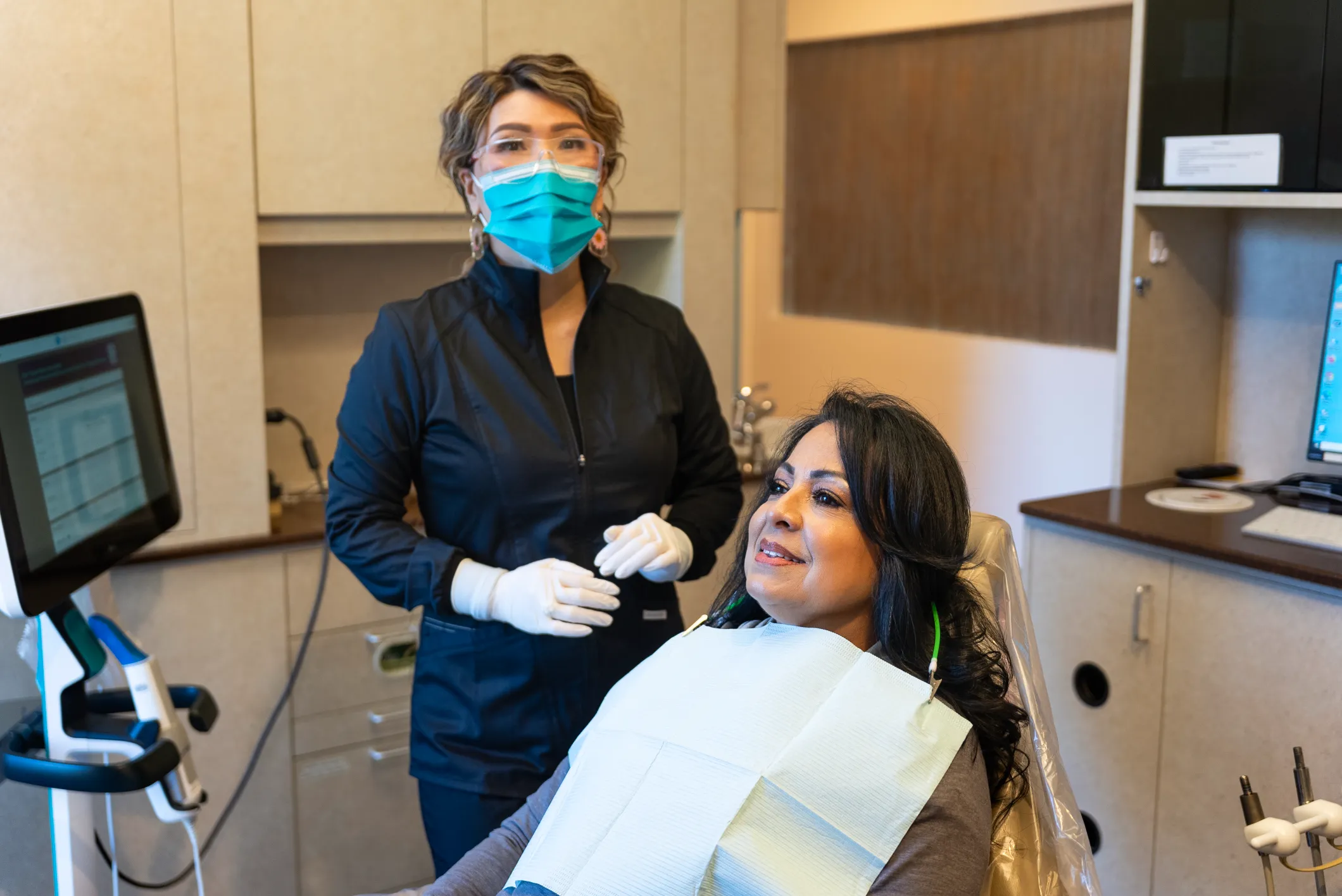 Dentist performing dental checkup and teeth cleaning