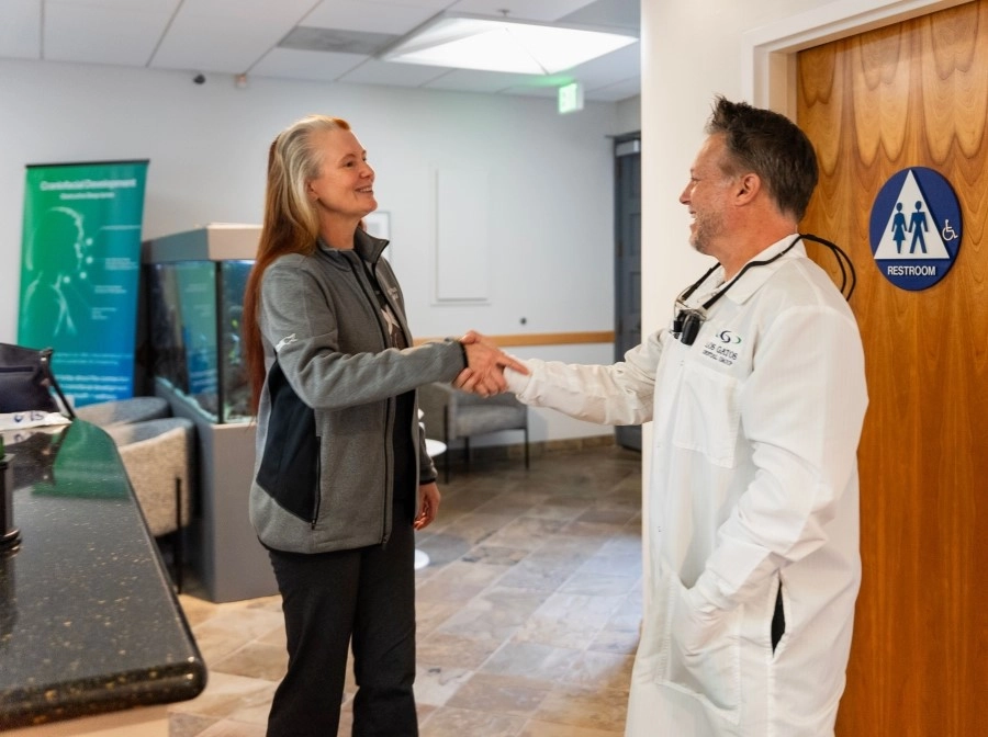 The doctor and patient exchanging a handshake at the Los Gatos dental office