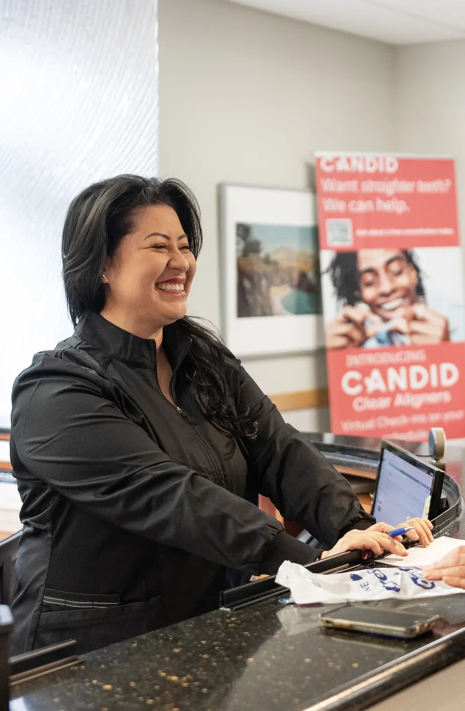 Receptionist explaining guidelines