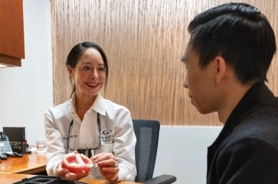 Doctor holding an Invisalign orthodontics tray