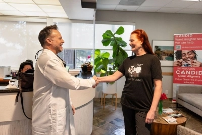 Doctor shaking the patient's hand and both smiling