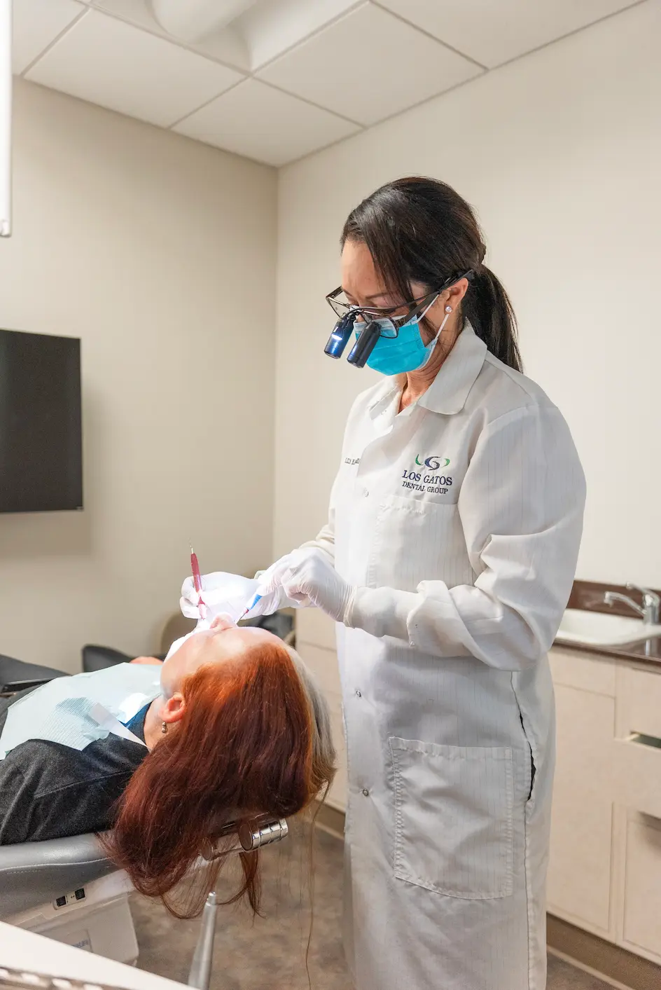 Patient receiving laser dentistry treatment