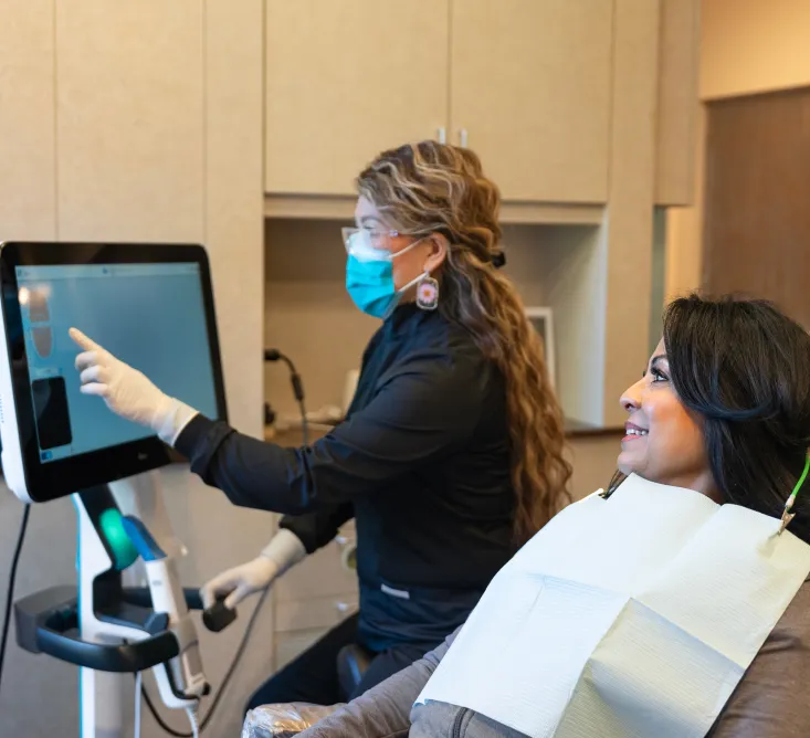 A dental assistant and patient at Los Gatos Dental Group  
